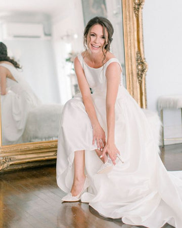 Bella Belle Kaite in Giselle ivory lace bridal heel with an elegant silk gown
