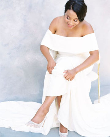 Leslie looked amazing in Elsa crystal wedding pumps and a classic silk wedding gown.