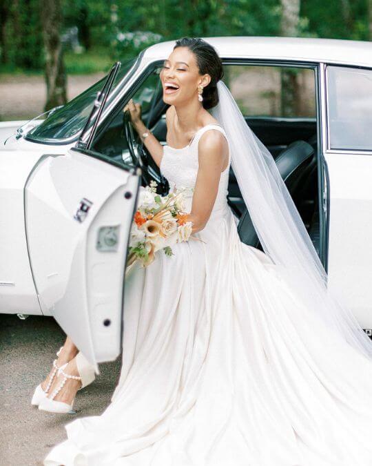 Bella Belle real bride Cindy in Lisbeth ivory pearl wedding heels with bows.