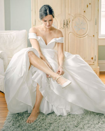 Bella Belle bride Caroline looks timeless and elegant in Lucia pearl wedding shoes.