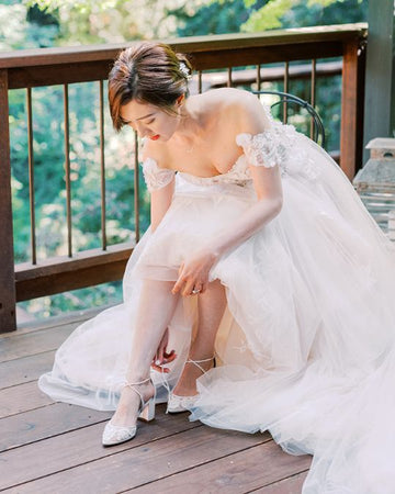 Joyce paired Abigail lace wedding block heels with an elegant lace wedding gown. 