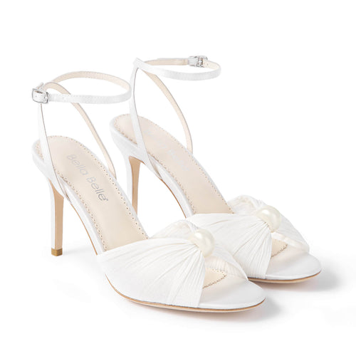 Ivory heeled sandals pair, open toe with ruched knot bow and slingback ankle straps