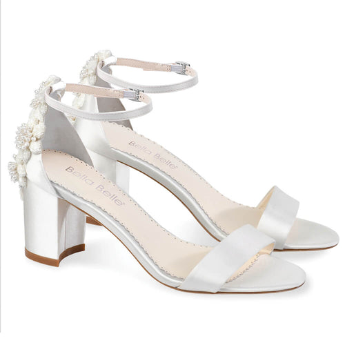 Ivory embellished heeled sandals with ankle strap and floral detail