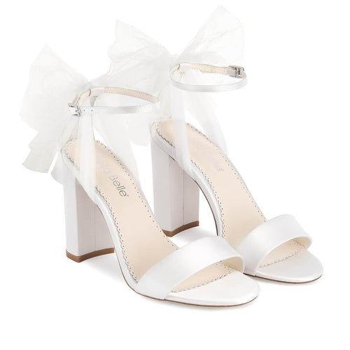 Ivory open-toe heeled sandals with tulle bow, ankle strap, and cushioned footbed